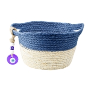 Close-up view of the empty, reusable blue and beige woven wicker basket featuring the traditional ceramic Greek evil eye (mati) protection charm.