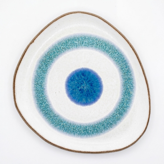 Handmade organic-shaped ceramic plate featuring a turquoise and blue Aegean eye design on white stoneware.